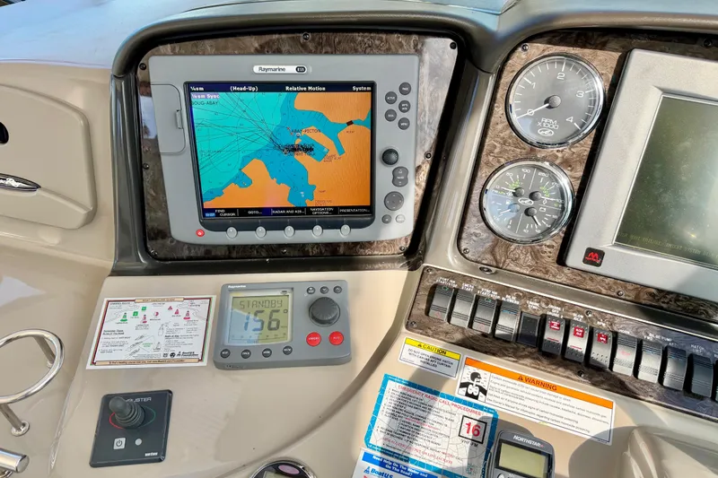 Slide: The Image of Dashboard of a 2008 Sea Ray 44 Sundancer with navigation and control instruments. - 16