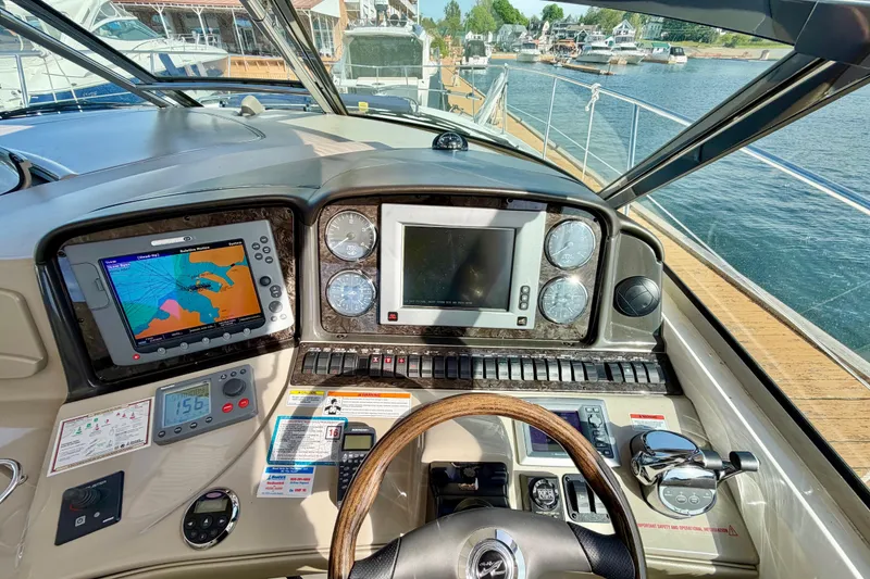 Slide: The Image of Cockpit view of 2008 Sea Ray 44 Sundancer with navigation and control systems. - 17