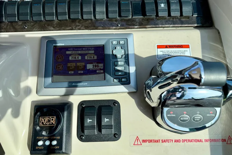 Slide: The Image of Control panel of a 2008 Sea Ray 44 Sundancer with VesselView display and throttle controls. - 18