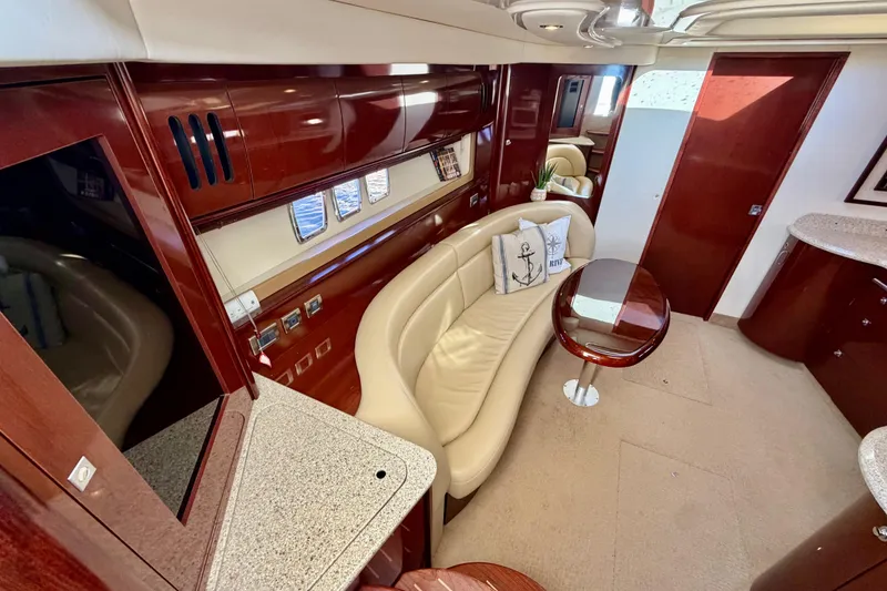 Slide: The Image of Luxurious interior of 2008 Sea Ray 44 Sundancer yacht with elegant seating and wooden finishes. - 23