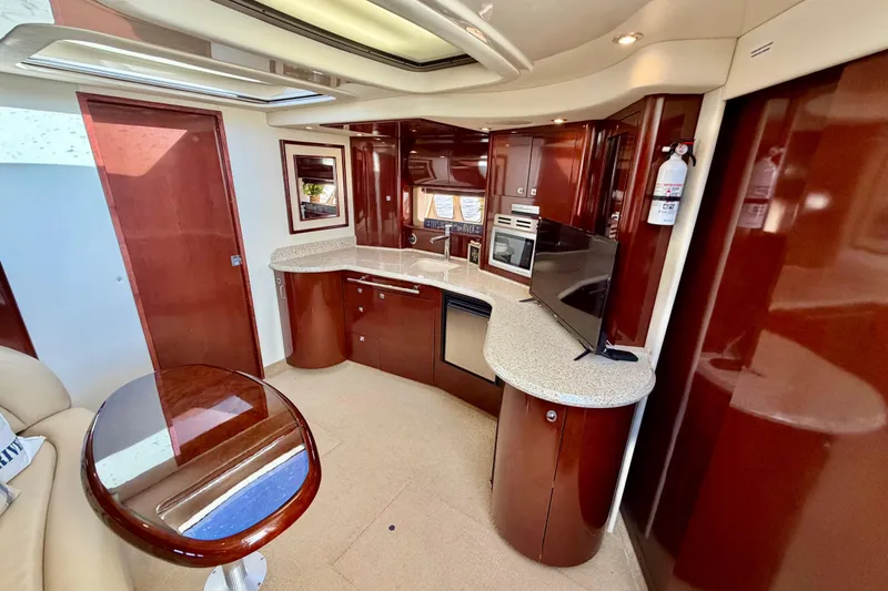 Slide: The Image of Luxurious interior of 2008 Sea Ray 44 Sundancer yacht with modern kitchen amenities. - 25