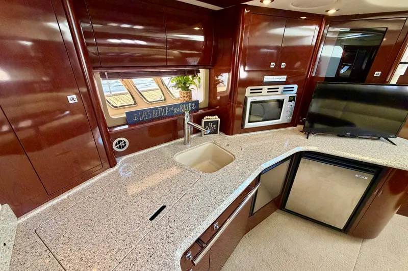 Slide: The Image of Luxurious 2008 Sea Ray 44 Sundancer yacht interior with modern kitchen amenities. - 27