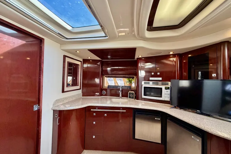 Slide: The Image of Luxurious 2008 Sea Ray 44 Sundancer yacht interior with modern kitchen amenities. - 29