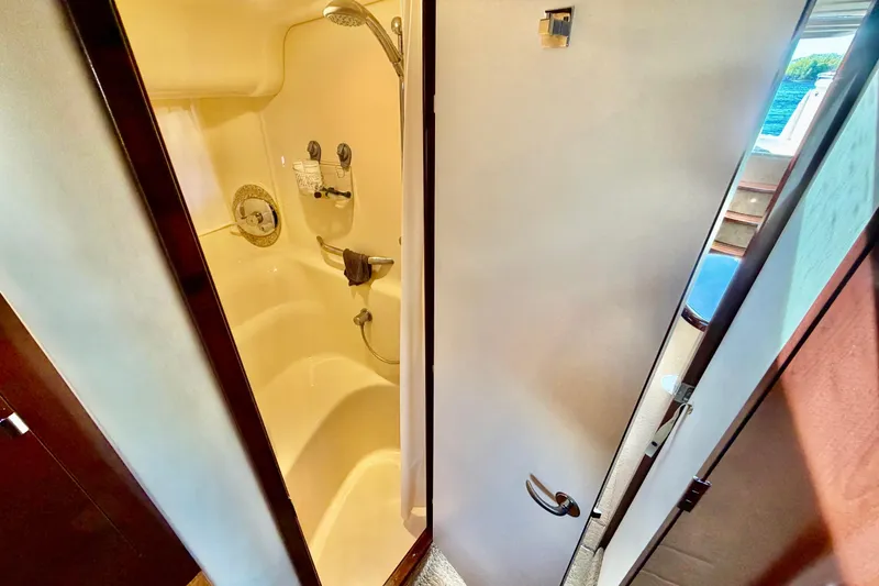 Slide: The Image of Shower area inside 2008 Sea Ray 44 Sundancer yacht, featuring modern fixtures and compact design. - 34