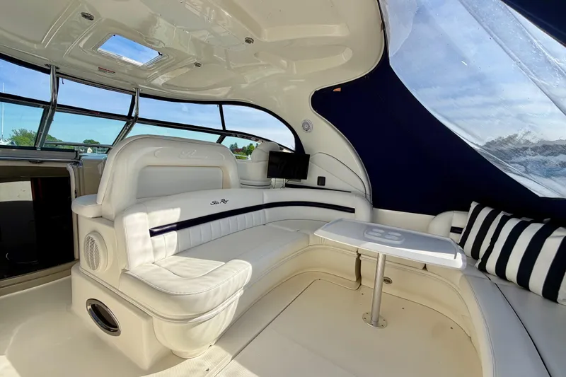 Slide: The Image of Luxurious interior of 2008 Sea Ray 44 Sundancer yacht with plush seating and panoramic windows. - 42