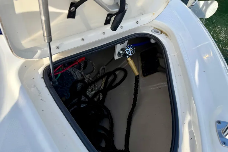 Slide: The Image of Open storage compartment on 2008 Sea Ray 44 Sundancer boat with ropes and fittings. - 49