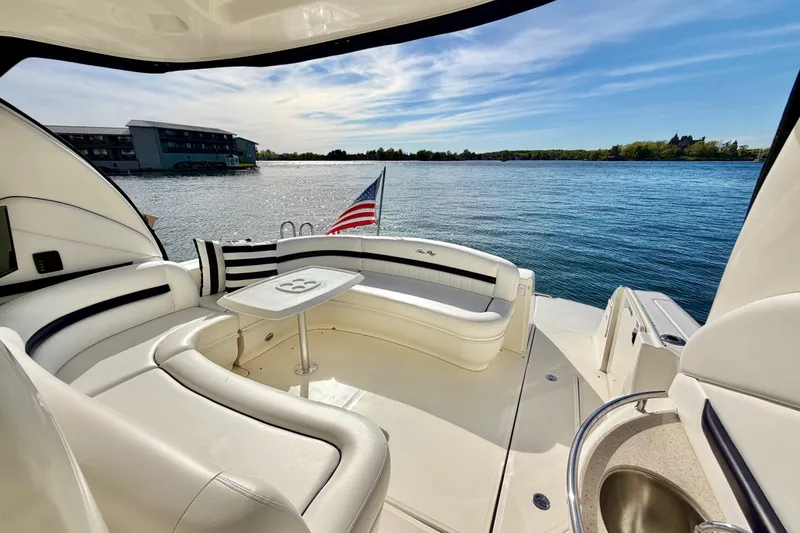 Slide: The Image of Luxurious 2008 Sea Ray 44 Sundancer yacht interior with waterfront view and American flag. - 5