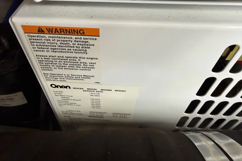 Slide: The Image of Warning label and service data on 2008 Sea Ray 44 Sundancer engine compartment. - 52