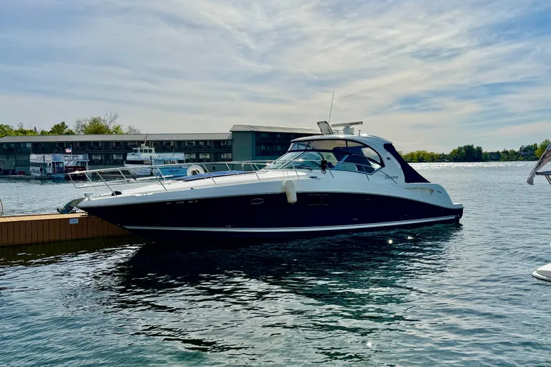 Slide: The Image of 2008 Sea Ray 44 Sundancer yacht docked on a sunny day. - 58