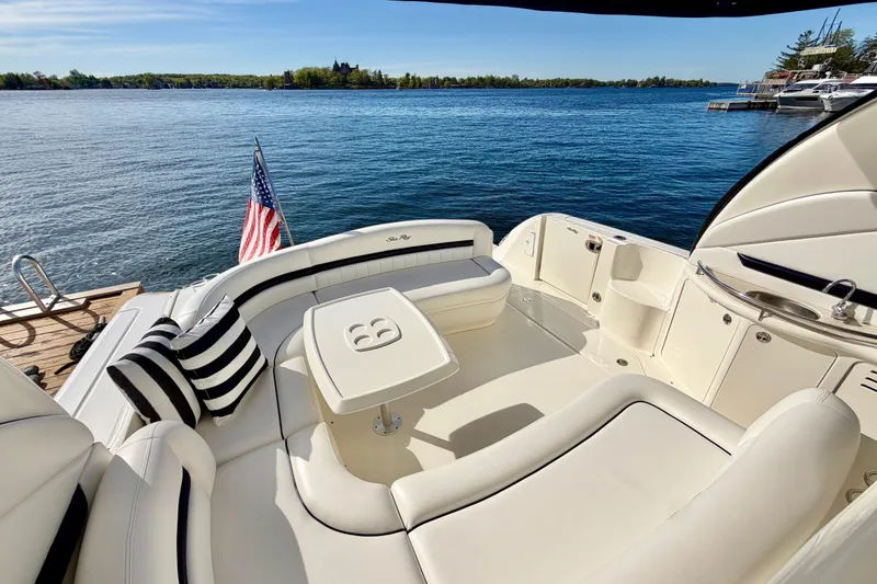 Slide: The Image of Luxurious 2008 Sea Ray 44 Sundancer yacht interior with elegant seating and scenic water view. - 6
