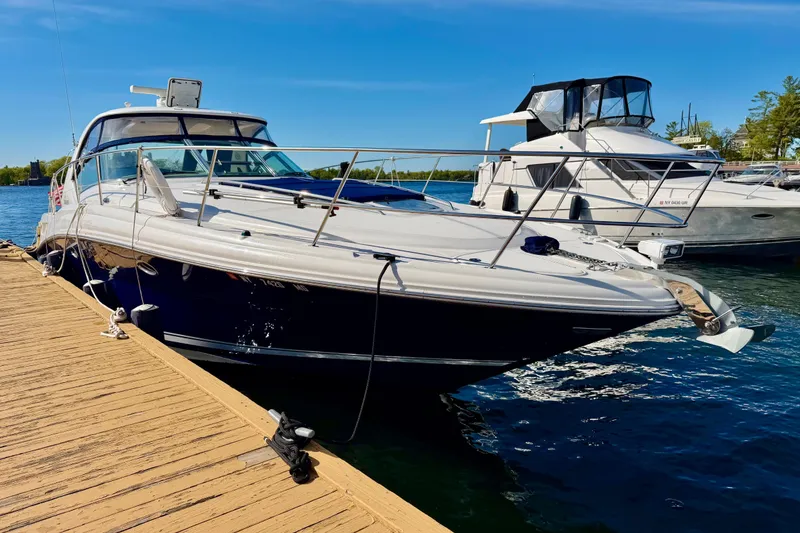 Slide: The Image of 2008 Sea Ray 44 Sundancer yacht docked at marina under clear blue sky. - 60