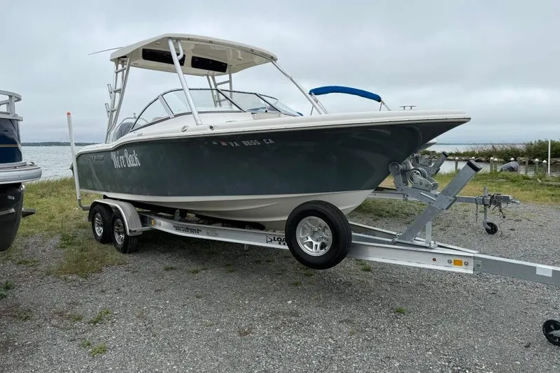 Slide: The Image of 2018 Key West 239 DFS boat on trailer by the water. - 1