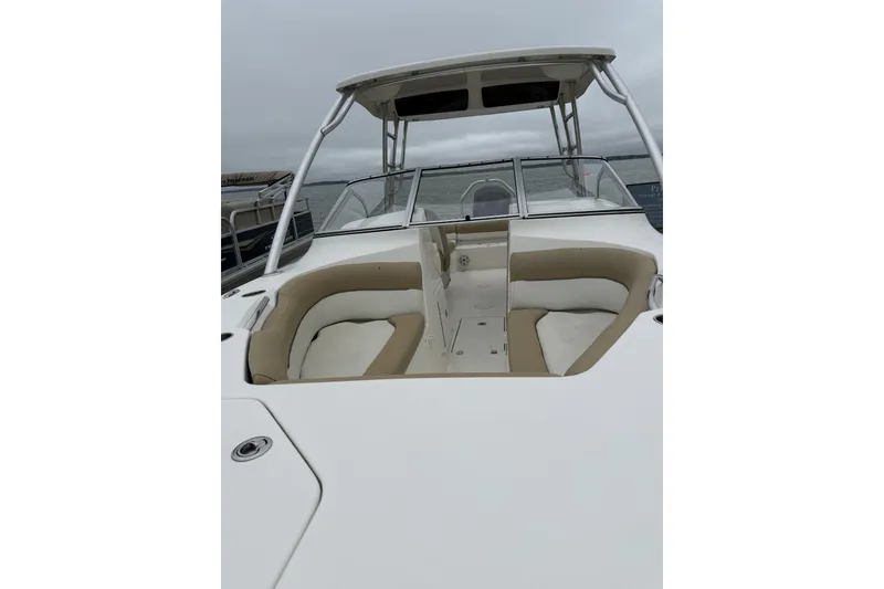 Slide: The Image of 2018 Key West 239 DFS boat with spacious seating and sleek design on a cloudy day. - 8