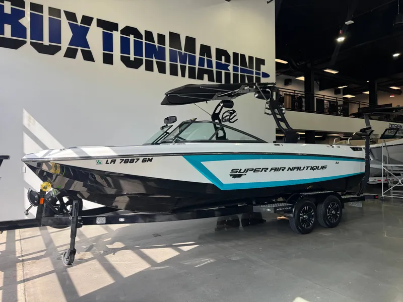 Slide: The Image of 2019 Nautique Super Air Nautique GS24 boat in showroom. - 3