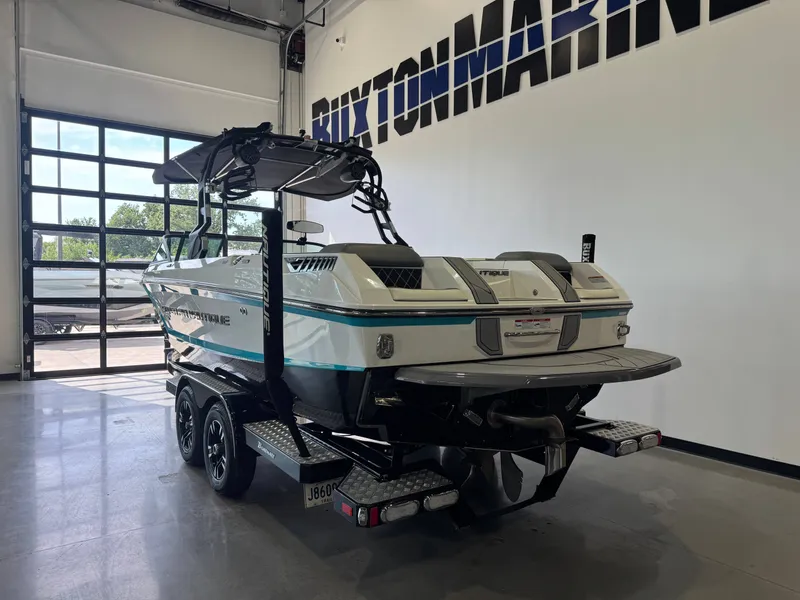Slide: The Image of 2019 Nautique Super Air Nautique GS24 in a showroom. - 5