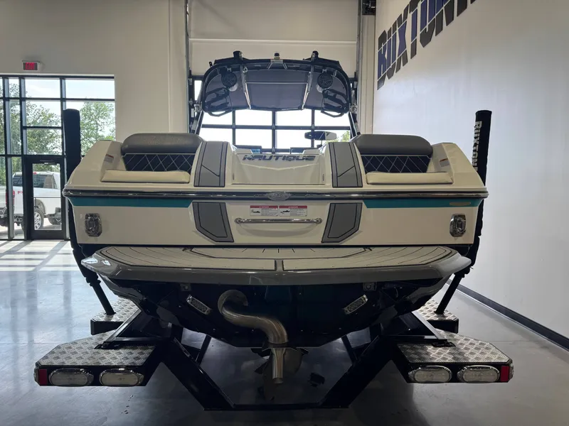 Slide: The Image of 2019 Nautique Super Air Nautique GS24 in a garage. - 6