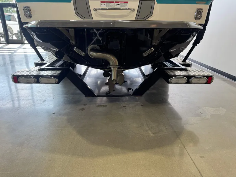 Slide: The Image of Rear view of a 2019 Nautique Super Air Nautique GS24 boat. - 7