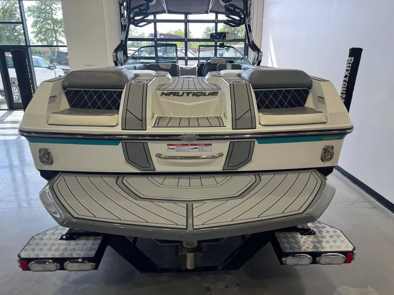 Slide: The Image of 2019 Nautique Super Air Nautique GS24 in showroom, rear view. - 8