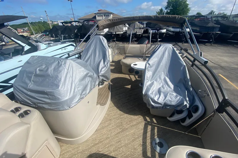 Slide: The Image of 2023 JC Swingback 27 TT Sport boat interior with covered seats and modern amenities. - 13