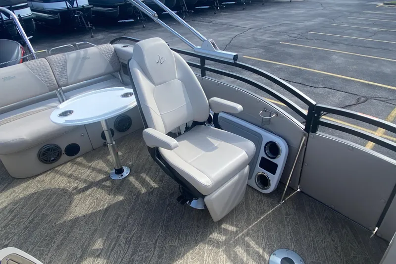Slide: The Image of 2023 JC Swingback 27 TT Sport boat interior with seating and table. - 16