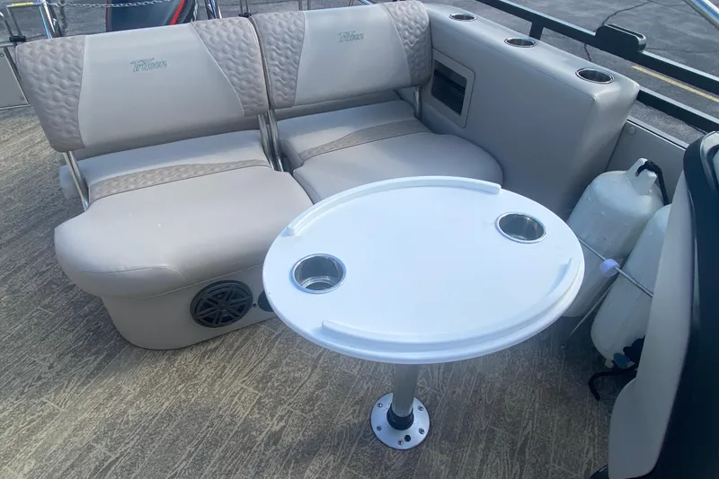 Slide: The Image of Luxurious seating area on 2023 JC Swingback 27 TT Sport boat with table and cup holders. - 17