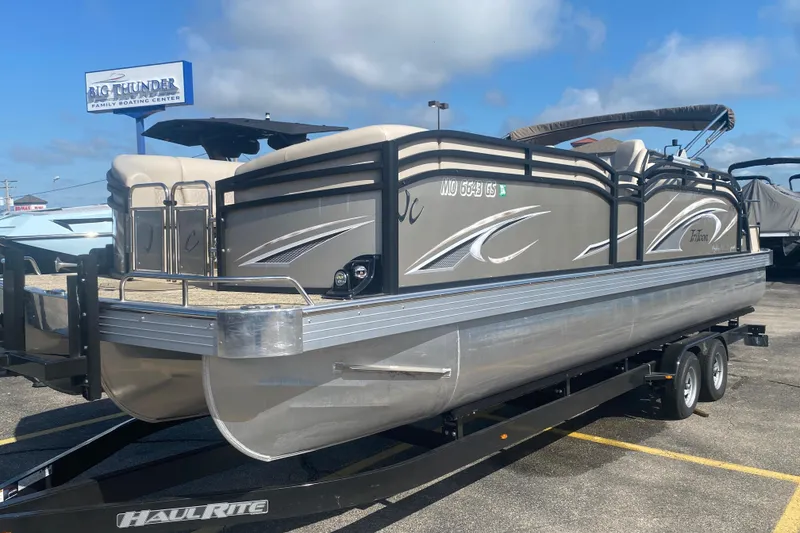 Slide: The Image of 2023 JC Swingback 27 TT Sport pontoon boat on trailer at Big Thunder Family Boating Center. - 2