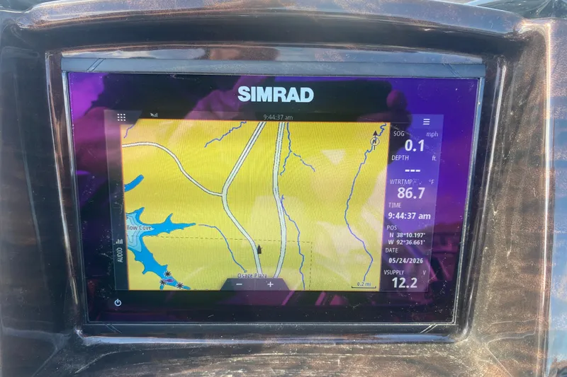 Slide: The Image of Simrad navigation display on 2023 JC Swingback 27 TT Sport boat, showing map and data. - 22