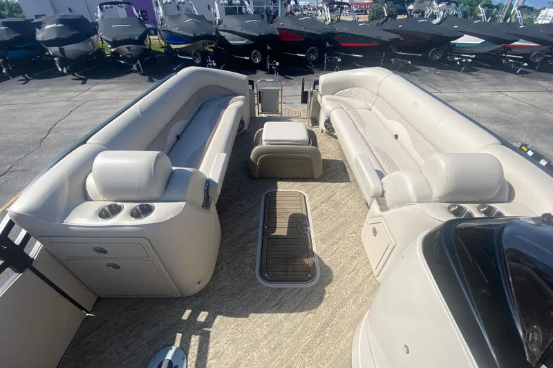 Slide: The Image of 2023 JC Swingback 27 TT Sport pontoon boat interior with luxurious seating and cup holders. - 28