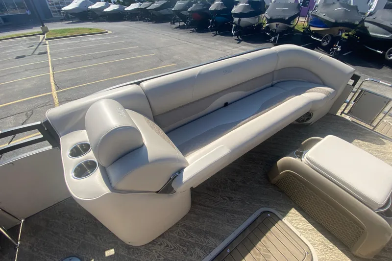 Slide: The Image of 2023 JC Swingback 27 TT Sport boat interior with beige seating and cup holders. - 29