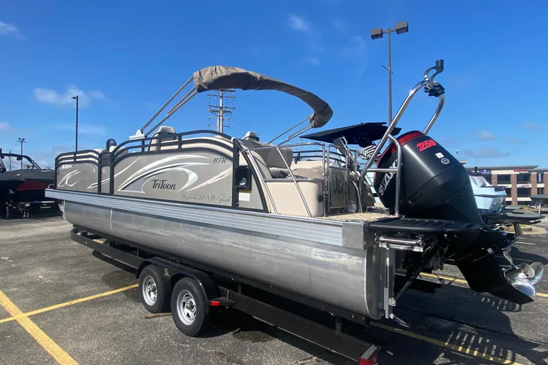 Slide: The Image of 2023 JC Swingback 27 TT Sport pontoon boat on trailer, featuring Suzuki 250 outboard motor. - 3