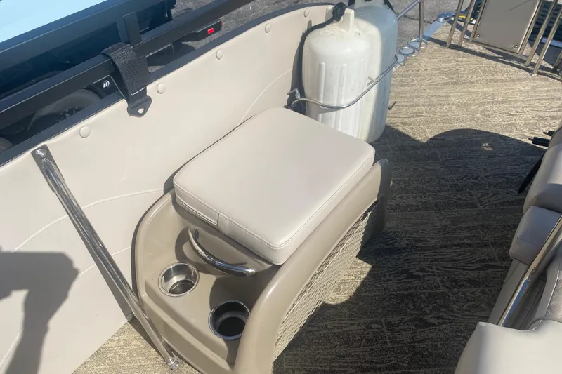 Slide: The Image of 2023 JC Swingback 27 TT Sport boat interior with cushioned seat and cup holders. - 31