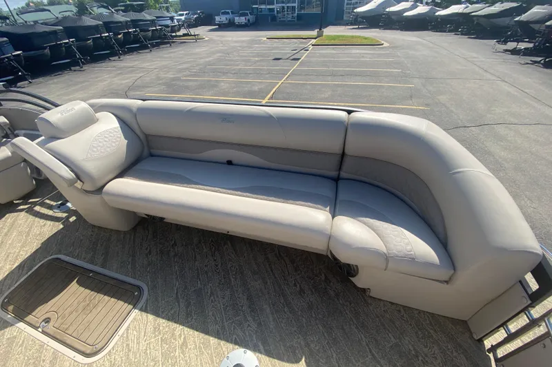 Slide: The Image of 2023 JC Swingback 27 TT Sport boat with luxurious gray seating in a parking lot. - 32
