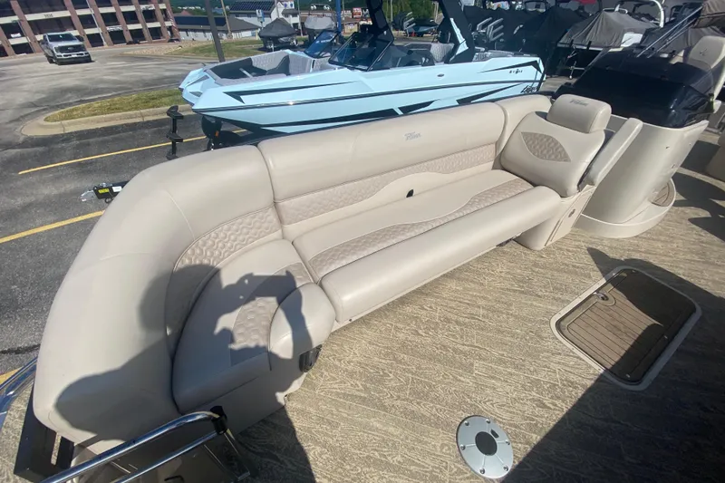 Slide: The Image of 2023 JC Swingback 27 TT Sport boat interior with beige seating and textured flooring. - 35