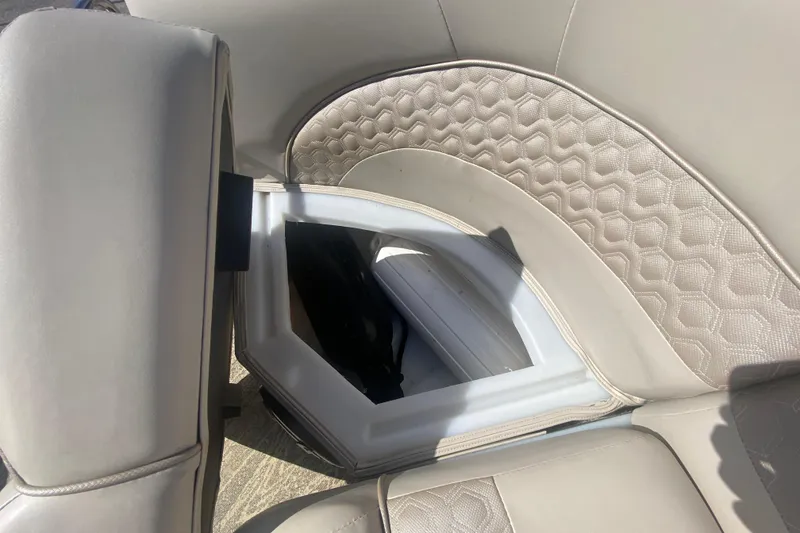 Slide: The Image of 2023 JC Swingback 27 TT Sport boat seat with storage compartment open. - 37
