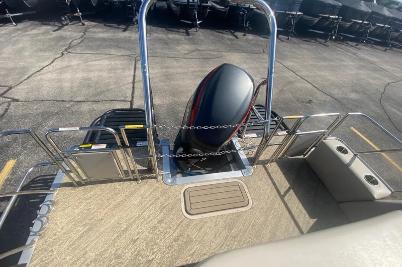Slide: The Image of 2023 JC Swingback 27 TT Sport boat deck with motor and safety railing. - 9