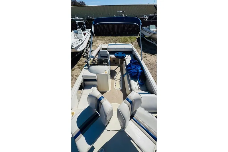 Slide: The Image of 2003 Galaxie 2100 Ultra F & S boat with spacious seating and canopy. - 4