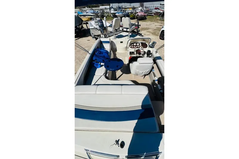 Slide: The Image of 2003 Galaxie 2100 Ultra F & S boat interior with seating and control panel. - 5