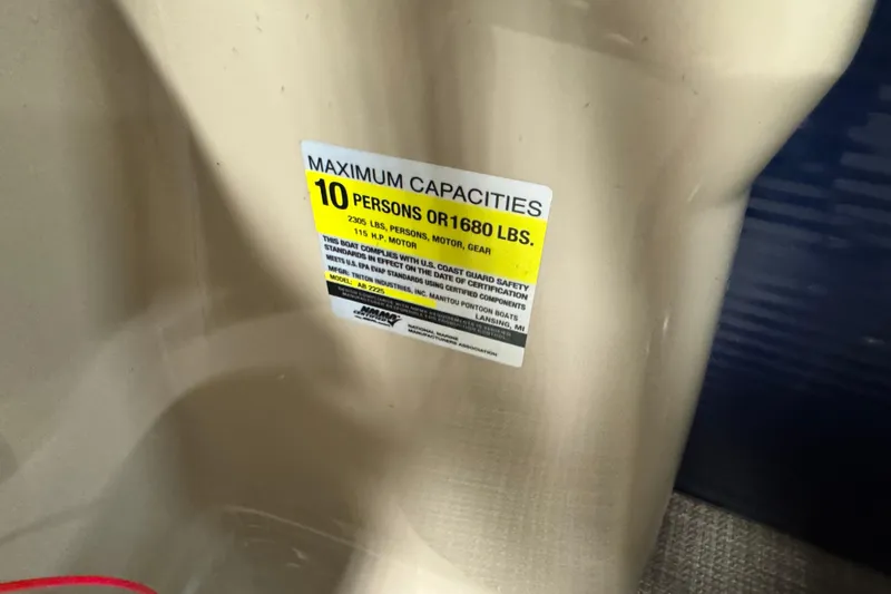 Slide: The Image of Capacity label on 2021 Manitou 22 Aurora LE Standard boat, max 10 persons or 1680 lbs. - 10