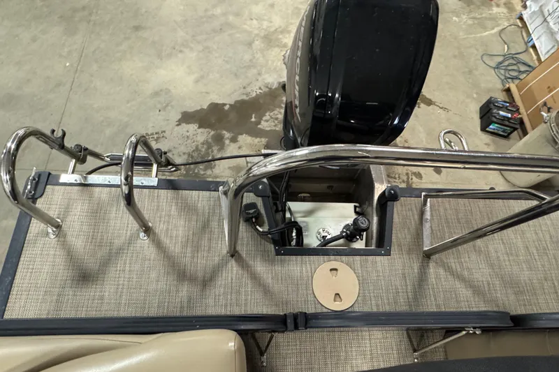 Slide: The Image of 2021 Manitou 22 Aurora LE Standard boat deck with motor and railing. - 13