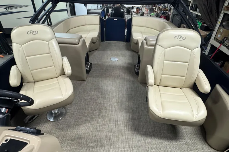 Slide: The Image of Interior of 2021 Manitou 22 Aurora LE Standard pontoon boat with beige seating. - 7