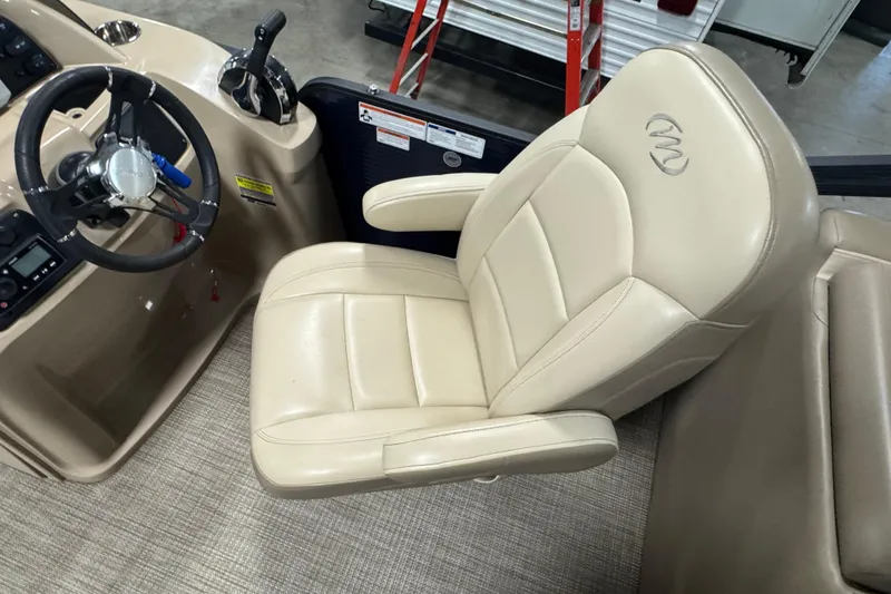 Slide: The Image of Captain's chair and steering wheel of 2021 Manitou 22 Aurora LE Standard boat. - 8