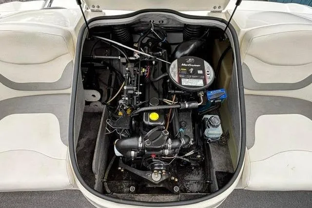 Slide: The Image of Engine compartment of a 2010 Bayliner 175 Bowrider, showcasing the MerCruiser engine. - 21
