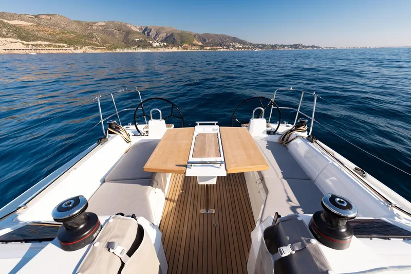 Slide: The Image of Beneteau Oceanis 34.1 2026 on open sea, cockpit view. - 8
