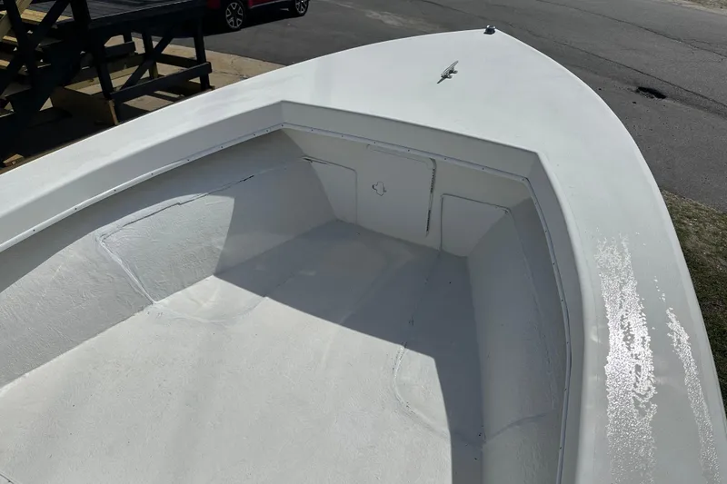Slide: The Image of 2021 C-Hawk 23 Center Console boat interior, showcasing spacious deck and storage compartments. - 10