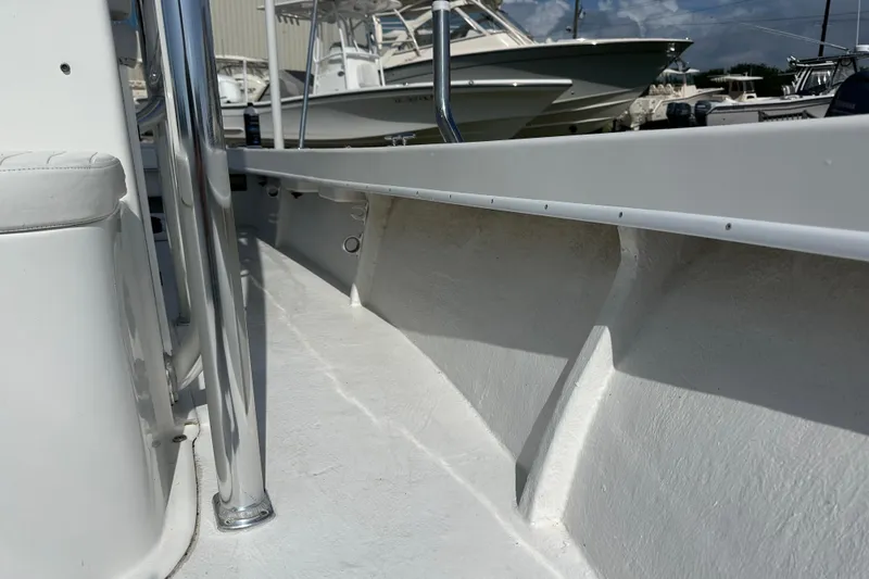 Slide: The Image of 2021 C-Hawk 23 Center Console boat interior with sleek white design and chrome details. - 14
