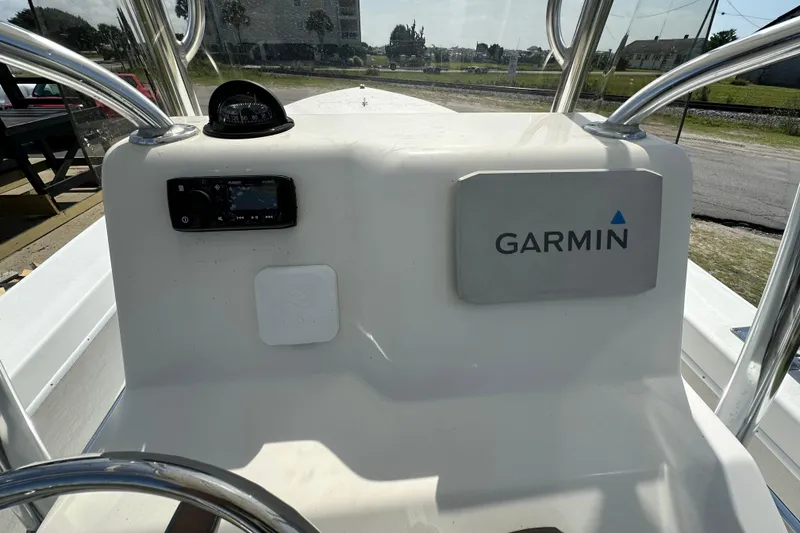 Slide: The Image of 2021 C-Hawk 23 Center Console boat dashboard with Garmin navigation system. - 20