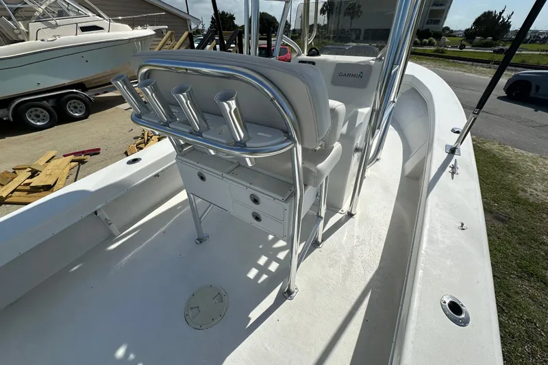 Slide: The Image of 2021 C-Hawk 23 Center Console boat interior with rod holders and seating. - 25