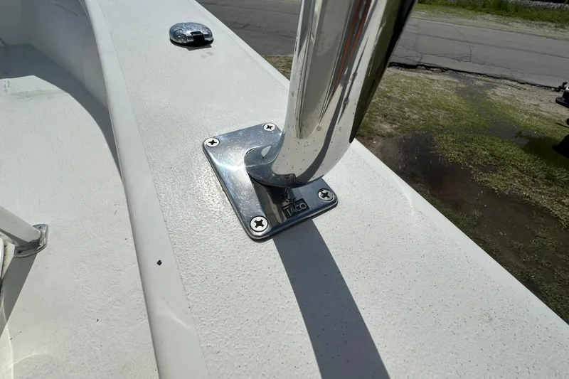 Slide: The Image of Close-up of a 2021 C-Hawk 23 Center Console boat's metal railing mount. - 27