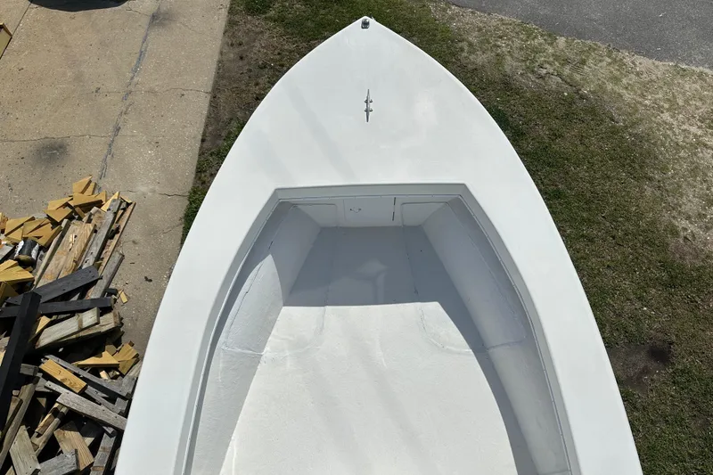 Slide: The Image of 2021 C-Hawk 23 Center Console boat viewed from above, on grass and pavement. - 29
