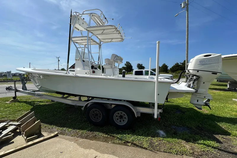 Slide: The Image of 2021 C-Hawk 23 Center Console boat on trailer with Suzuki outboard motor. - 5